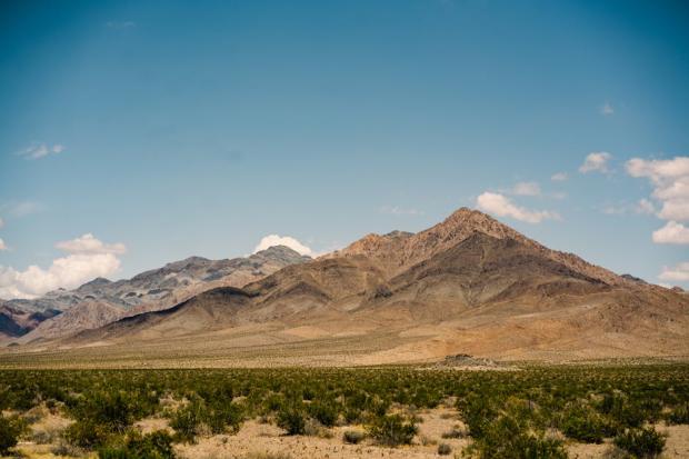Beautiful landscape of the Mojave Desert mountains under a clear blue sky in California.
